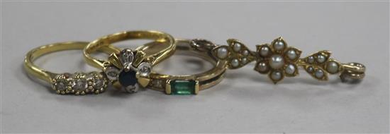 Three 18ct gold and gem set rings and a yellow metal and seed pearl bar brooch.